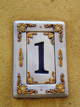 House number one sign on the wall