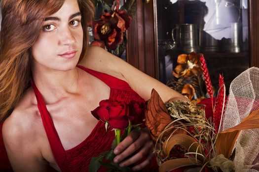 View of a beautiful young girl in a red dress on a living room.