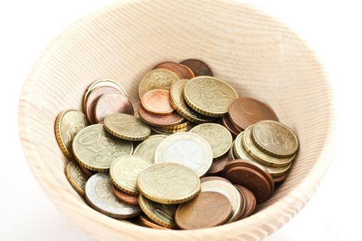 Wood cup full of savings in Euro, good for concepts
