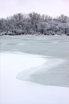 Freshly fallen snow on Pierce Lake at Rock Cut State Park - Illinois.