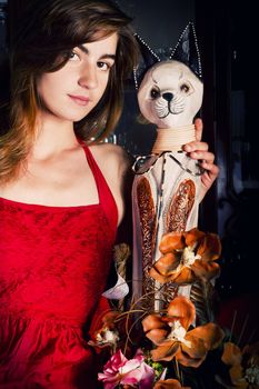 View of a beautiful young girl in a red dress on a living room.