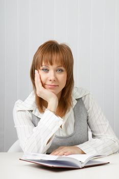 tired attractive young woman in a business office
