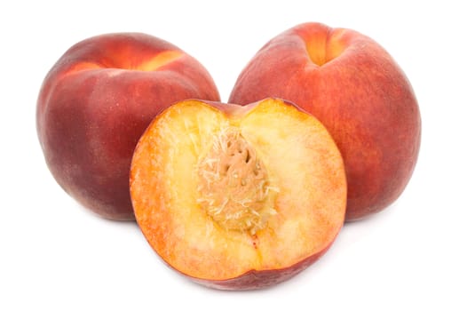 close-up heap of ripe peaches, isolated on white
