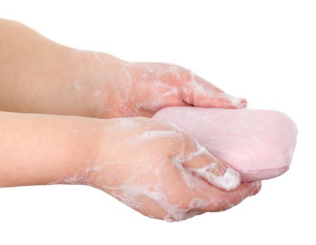 toilet soap in child's hands, isolated on white