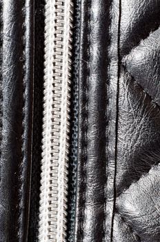 an image of zipper on black leather