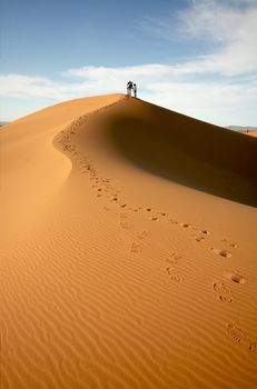 People at the dunes of the Moroccan Sahara