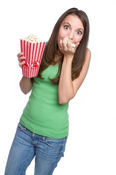 Isolated teenage girl eating popcorn
