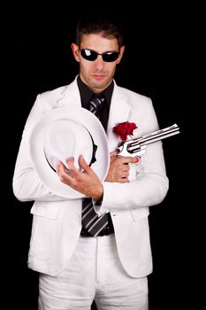 View of a white suit gangster man holding a gun.