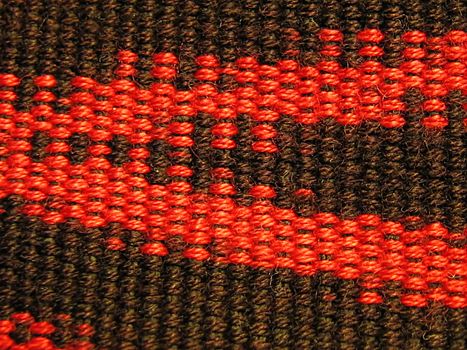 A photograph of red and black fabric.