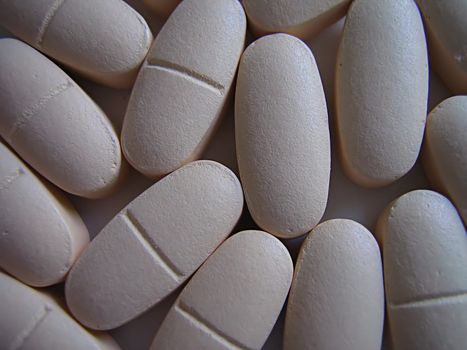 A photograph of pills detailing their shape.