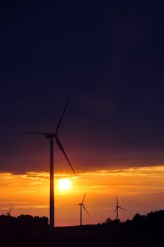 Wind turbines during beautiful sunset