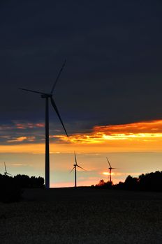 Wind turbines during beautiful sunset