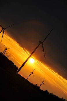 Wind turbines during beautiful sunset