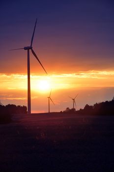 Wind turbines during beautiful sunset