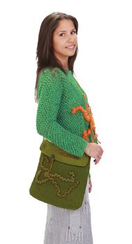 Young woman wearing knitwear clothes and purse,isolated against a white background.