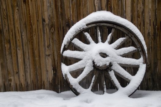 Old Wheel in Snow