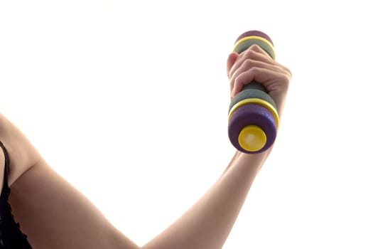 Female hand a holding dumbbell on a white background