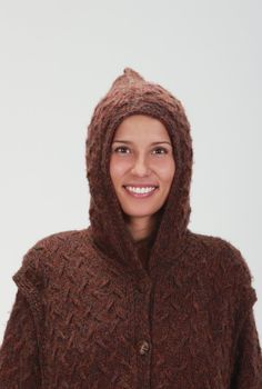 Portrait of a happy young woman in wool jacket with hood