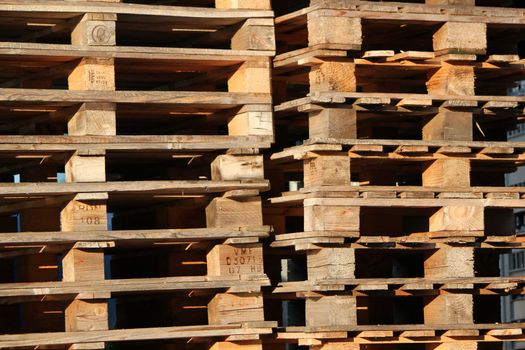 Close up of two piles of wooden palettes