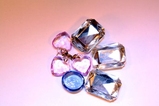 Heap of pink, blue and diamond jewelry
