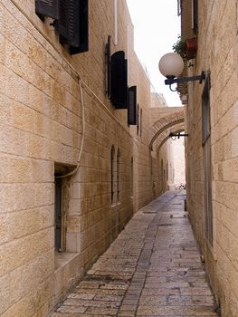 Israel - Jerusalem Old City Alley Jewish quarter made with hand curved stones vertical image