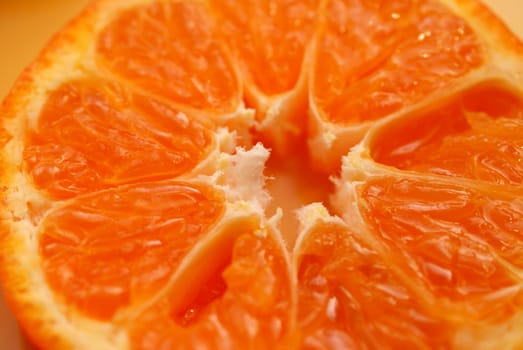 A close up of a mandarin slice, shallow depth of field.
