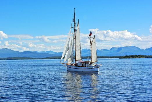 Twin mast sailboat floating on the calm sea