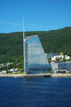 Modern building in form of sail on the seashore in Molde, Norway