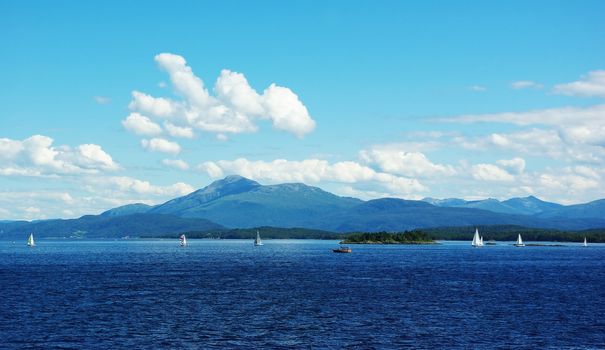 Beautiful view of the Norwegian coast of northern Atlantic with yachts and sailboats