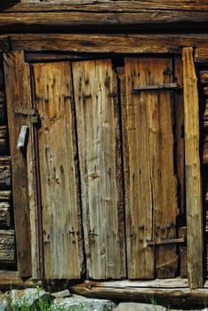 Close-up image of ancient wooden wethered door