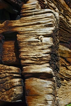 Close-up image of corner of ancient wooden house