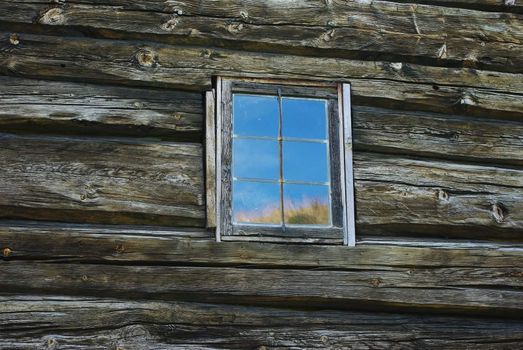 Window in old wooden weathered wall