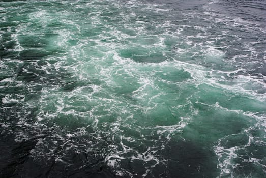 Beautiful colour wake from a cruise ship