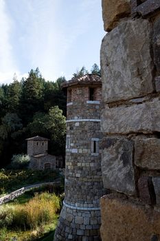 A tower made of stone that is part of a castle