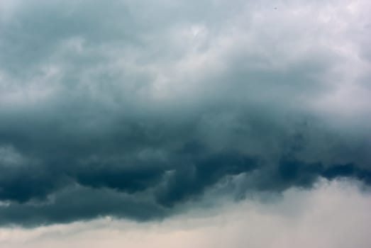 Heavy leaden thunderclouds sky background