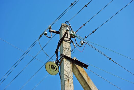 Old electric pole with wires and lighter