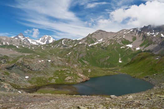 beautiful small lake in Aosta valley, Italy with Mont Blanc massif on background