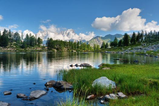 summer view of Arpy lake near La Thuile, Aosta valley, Italy. Image processed with hdr technique