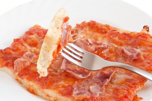 sliced pizza with mozzarella, tomatoes and ham