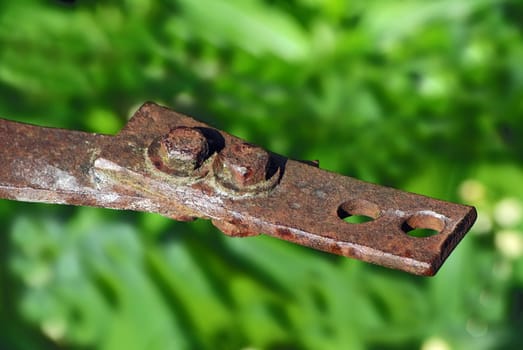 Rusty parts fastened with old bolts close up