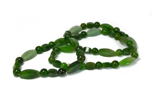Beautyful green jade beads on white background