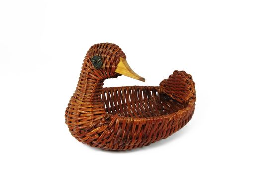 Wicker contaimer in form of duck on white background