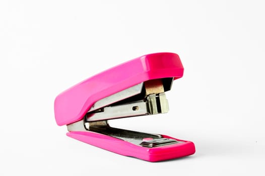 Pink  stapler isolated on white background