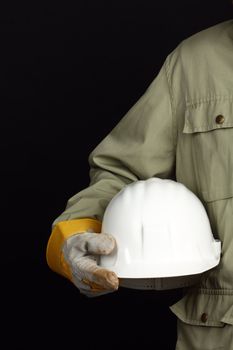 man holding white helmet over black background 