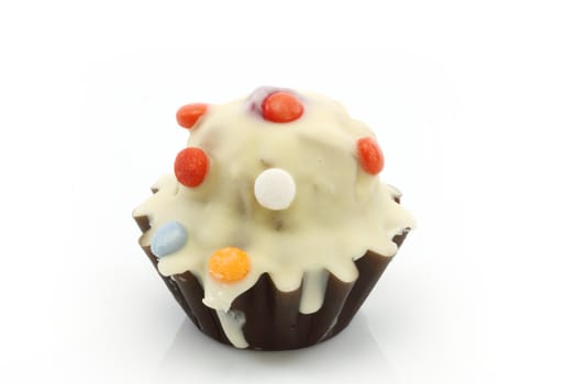 Close up of funny cupcake over white background