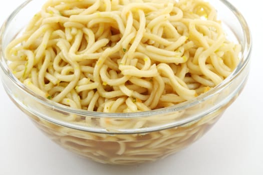 Bowl of instant noodles over white background