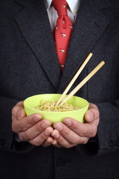 Man holding a bowl of soup  noodles