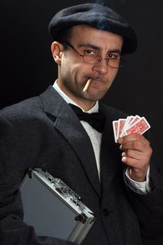 Portrait of a poker player over black background