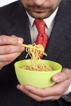 Man holding a bowl of soup  noodles