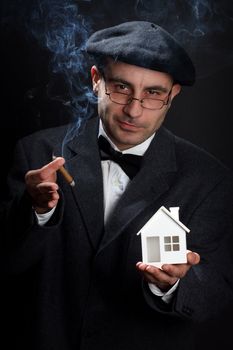 Portrait of retro looking salesman. Real estate concept